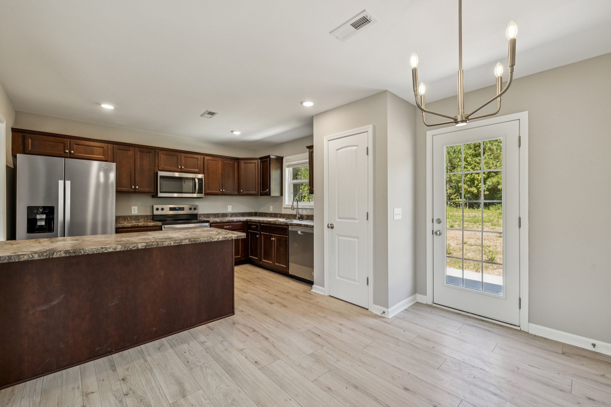146 Old Brick Church Road Estill Springs, TN 37330 - Photo 13 of 44 a kitchen with stainless steel appliances granite countertop a refrigerator a sink dishwasher a stove and a refrigerator