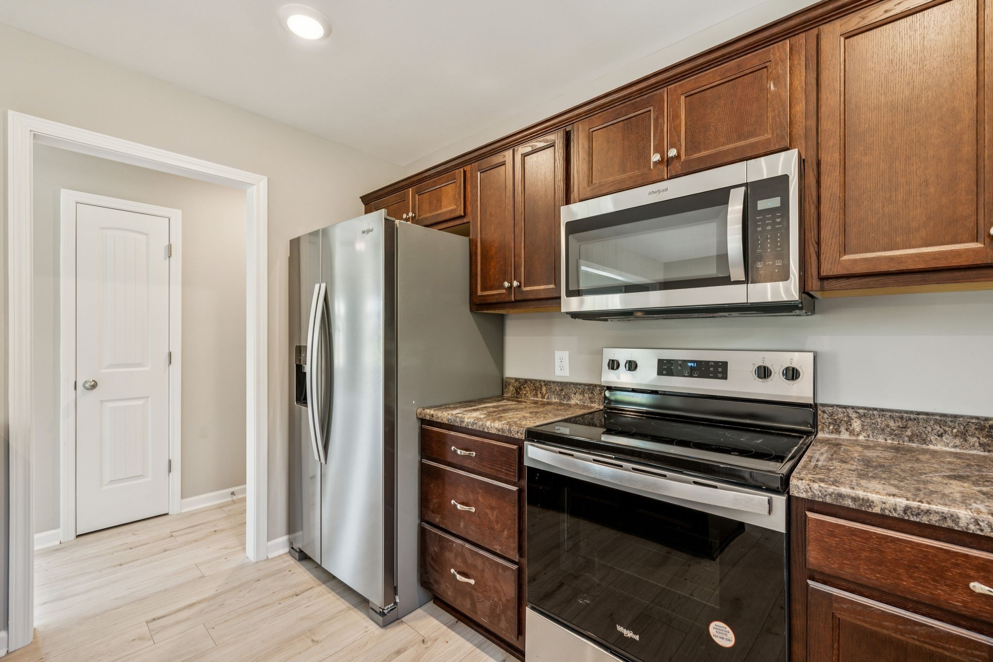 146 Old Brick Church Road Estill Springs, TN 37330 - Photo 18 of 44 a kitchen with stainless steel appliances granite countertop a stove microwave and refrigerator
