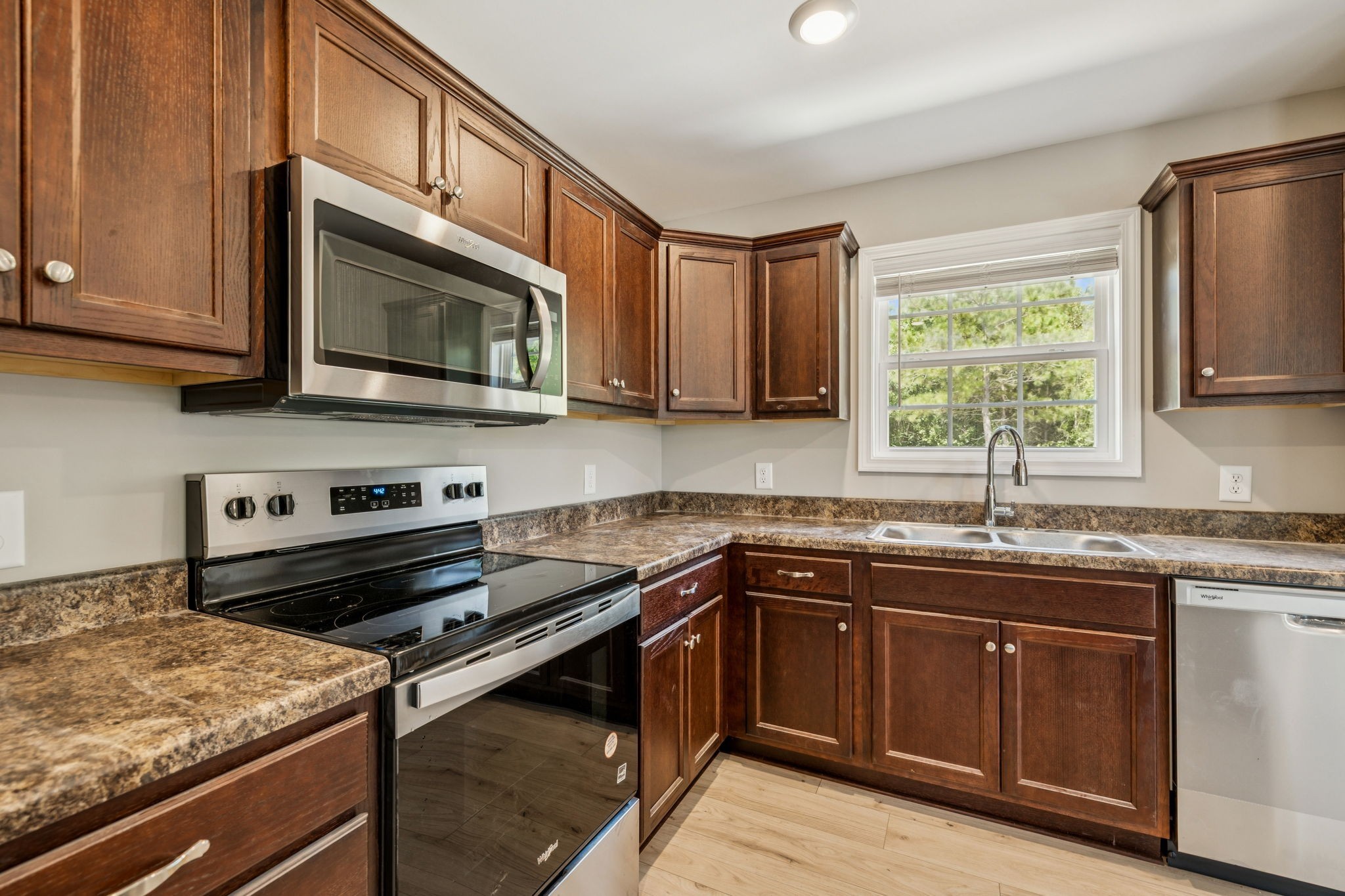 146 Old Brick Church Road Estill Springs, TN 37330 - Photo 21 of 44 a kitchen with a sink stove top oven and cabinets