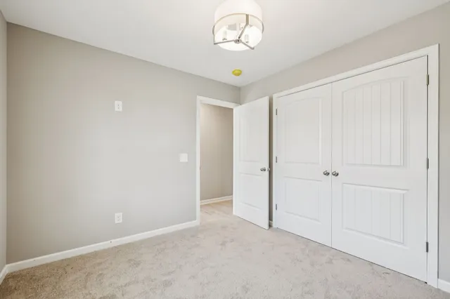 a view of an empty room and a window