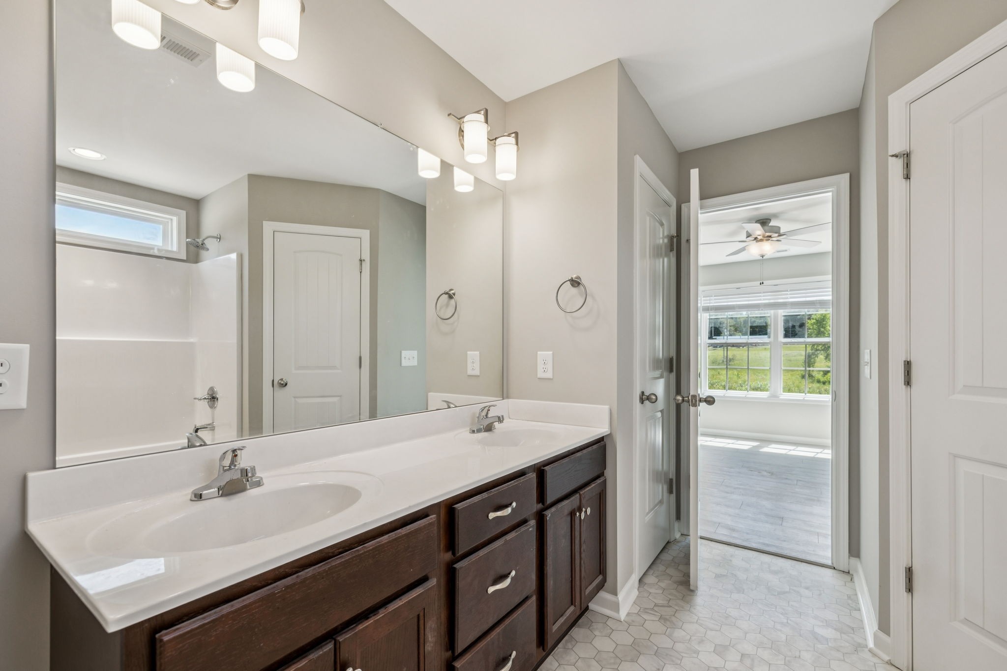 146 Old Brick Church Road Estill Springs, TN 37330 - Photo 37 of 44 a bathroom with a sink double vanity and a mirror