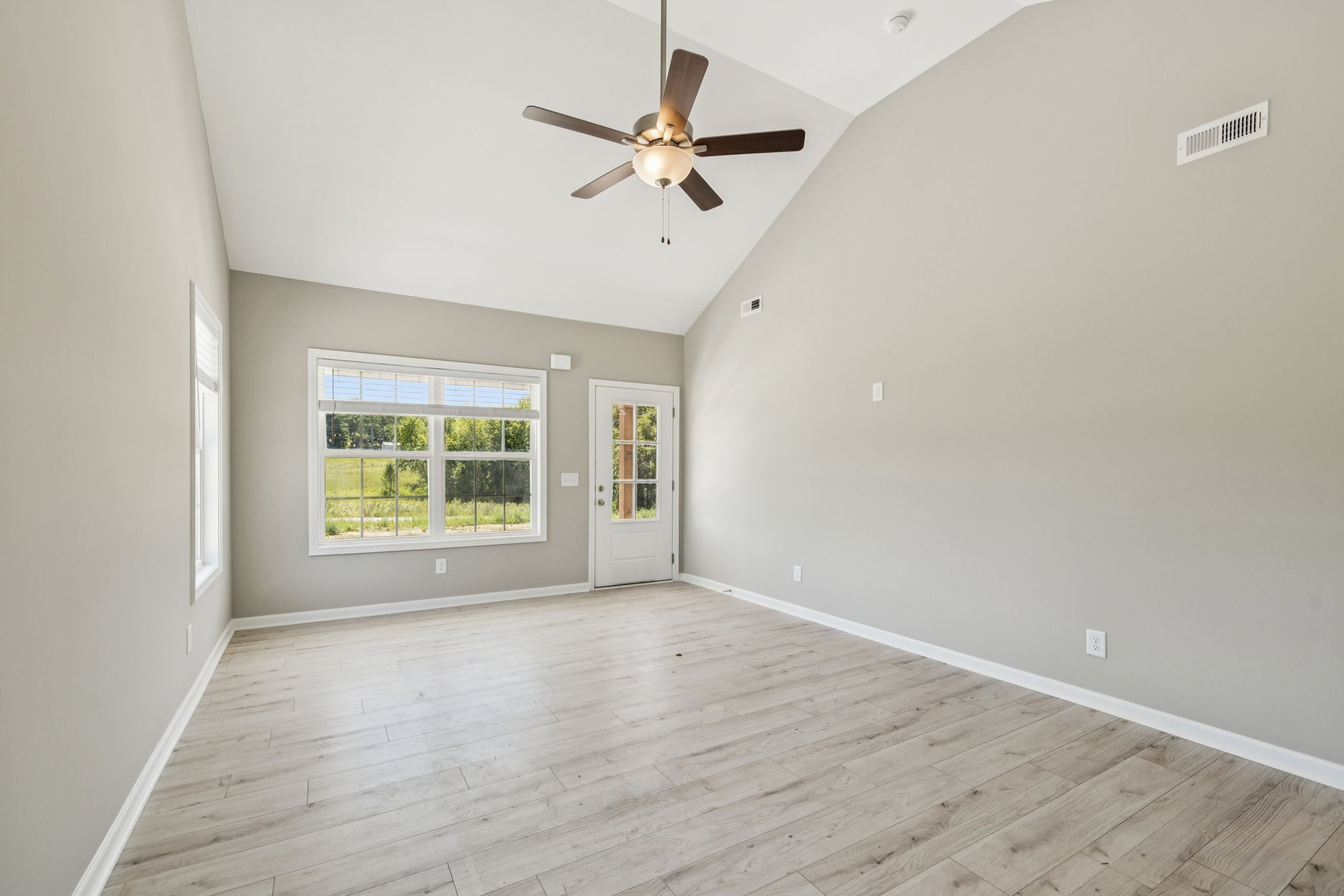 146 Old Brick Church Road Estill Springs, TN 37330 - Photo 9 of 44 wooden floor in an empty room with a window