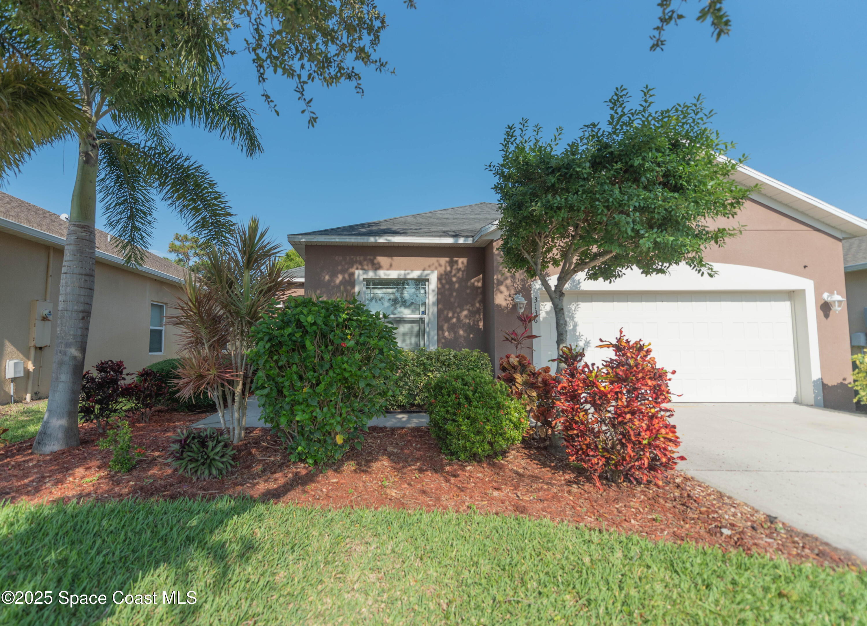 3136 Constellation Drive Melbourne, FL 32940 - Photo 1 of 28 a view of a house with a yard