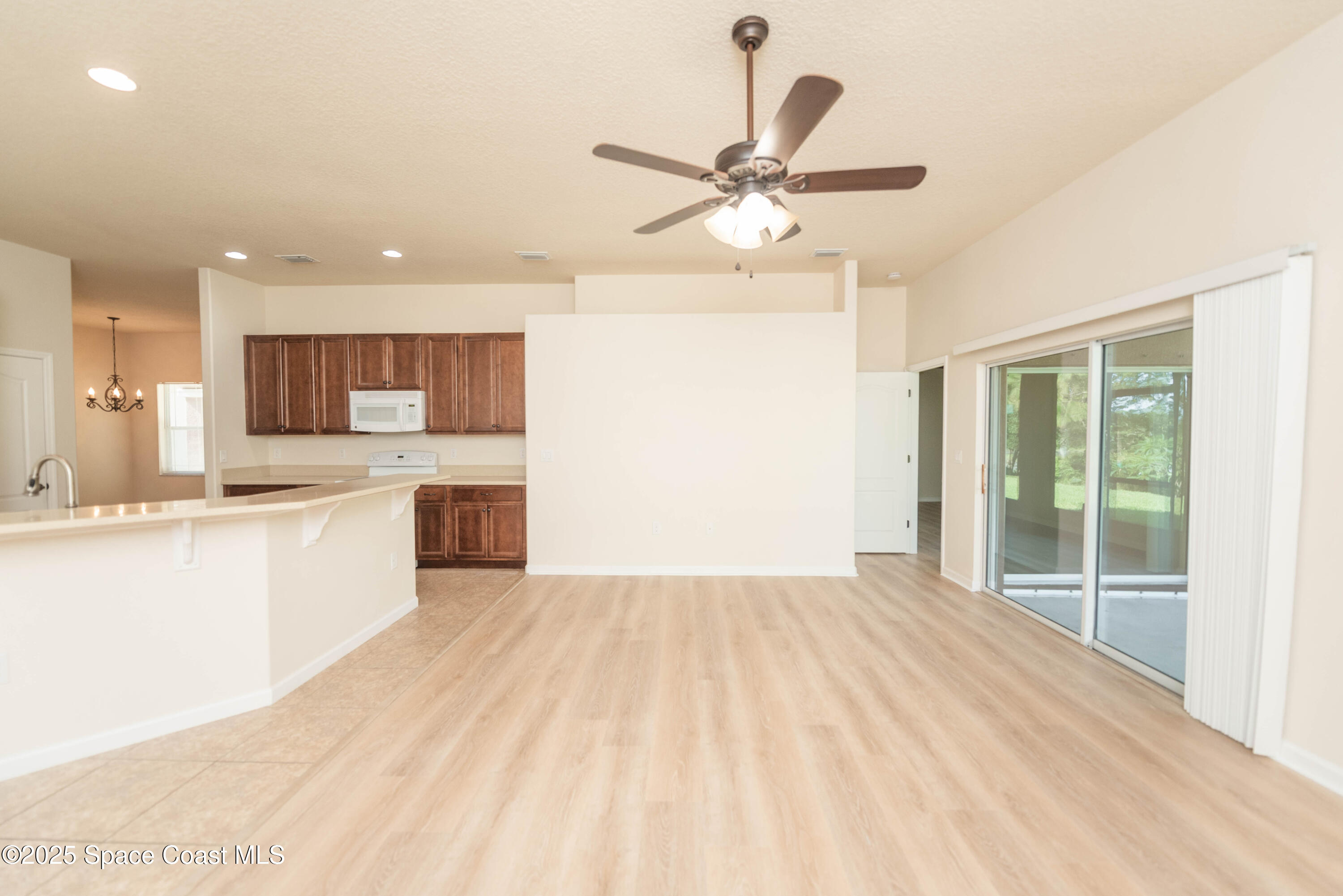 3136 Constellation Drive Melbourne, FL 32940 - Photo 14 of 28 a view of a kitchen with a sink and a window