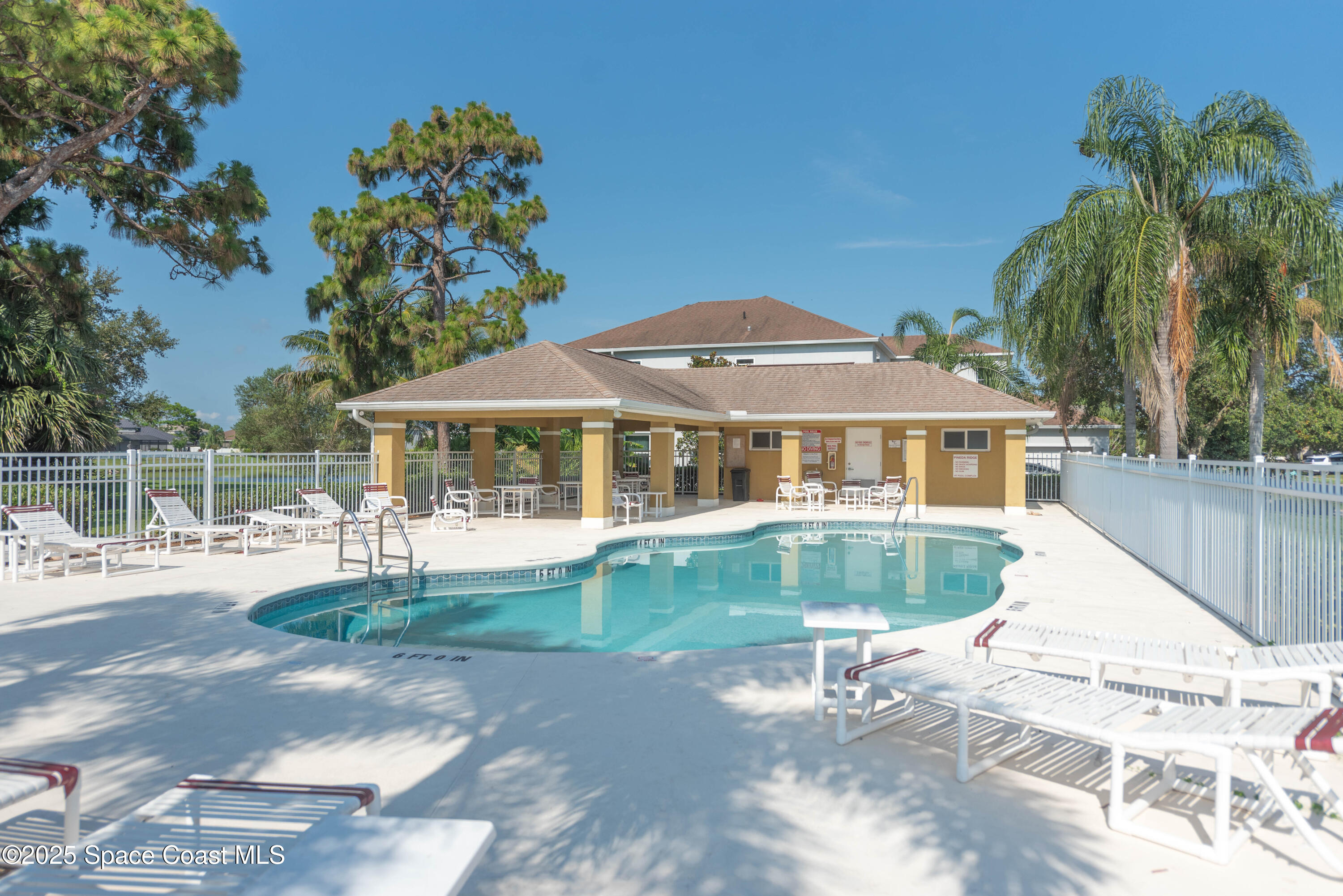 3136 Constellation Drive Melbourne, FL 32940 - Photo 26 of 28 a front view of a house with swimming pool