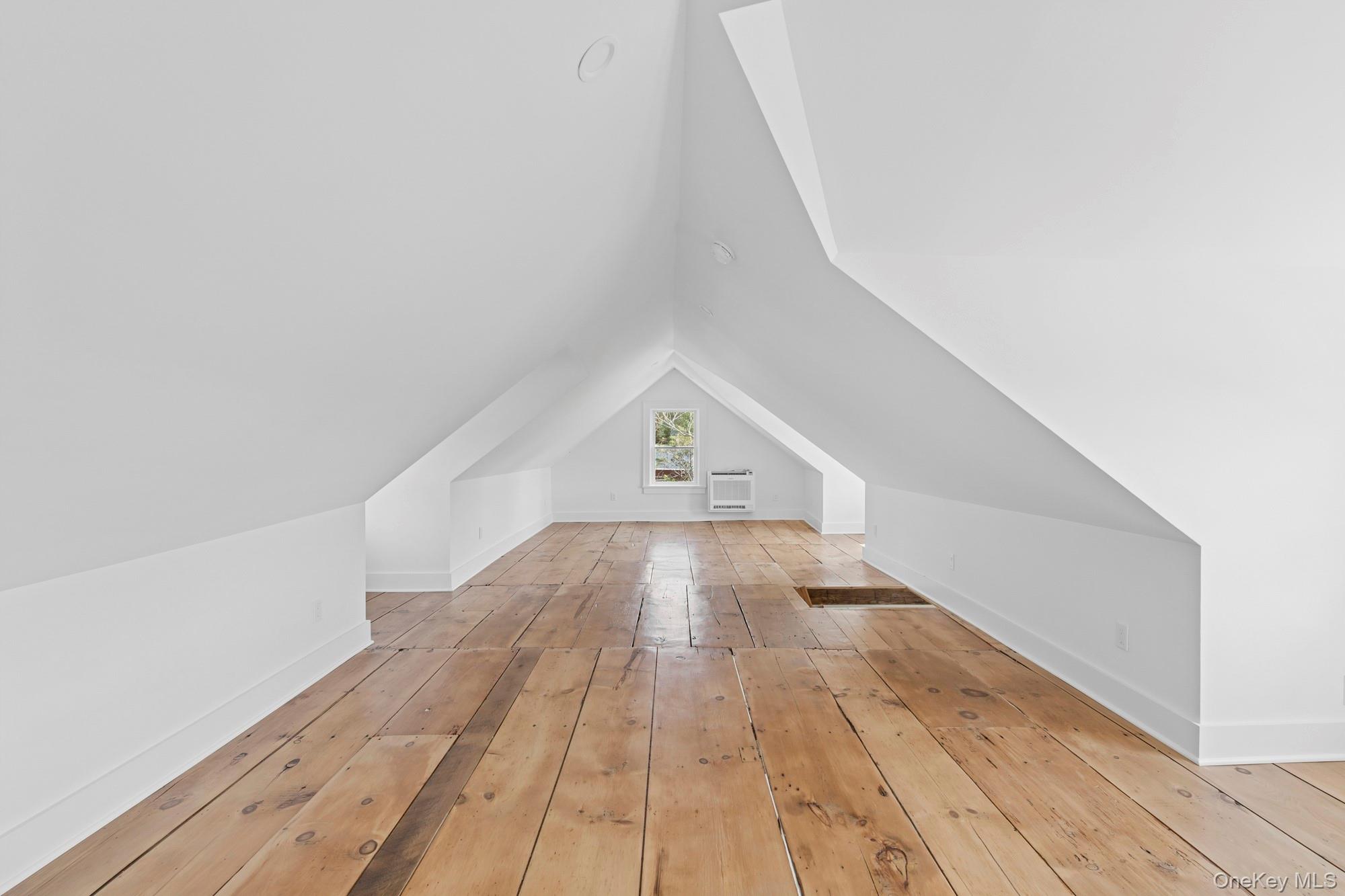 5075 Main Road Laurel, NY 11948 - Photo 13 of 22 a view of a hallway with wooden floor