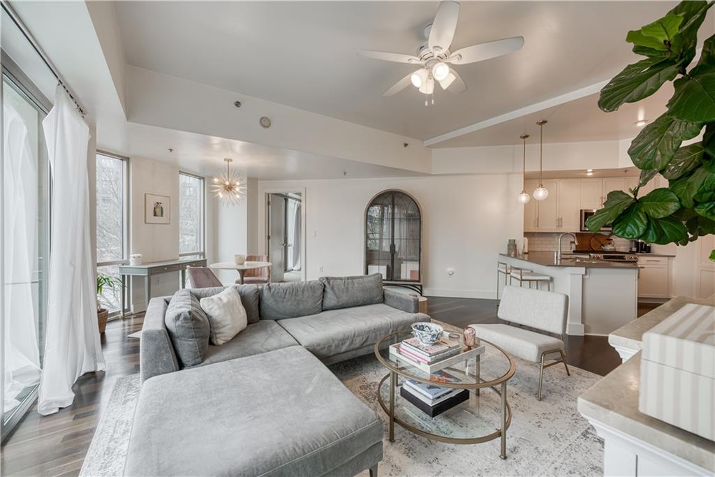 1100 Howell Mill Road Northwest, Unit 213 Atlanta, GA 30318 - Photo 1 of 1 a living room with furniture and a large window