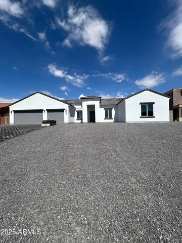 a backyard of a house with large trees