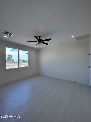 a white toilet sitting next to a white walls