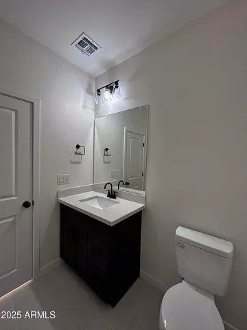 a view of a room with a ceiling fan