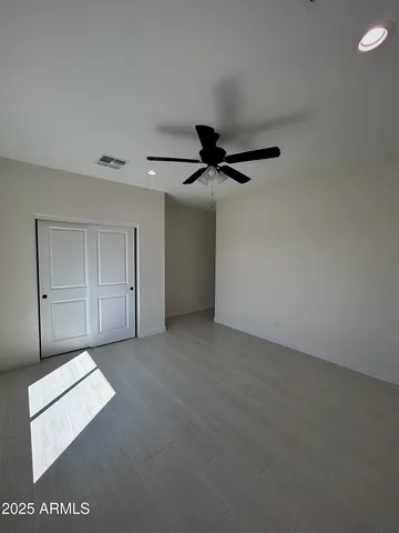 a view of a hall with floor to ceiling window and projector