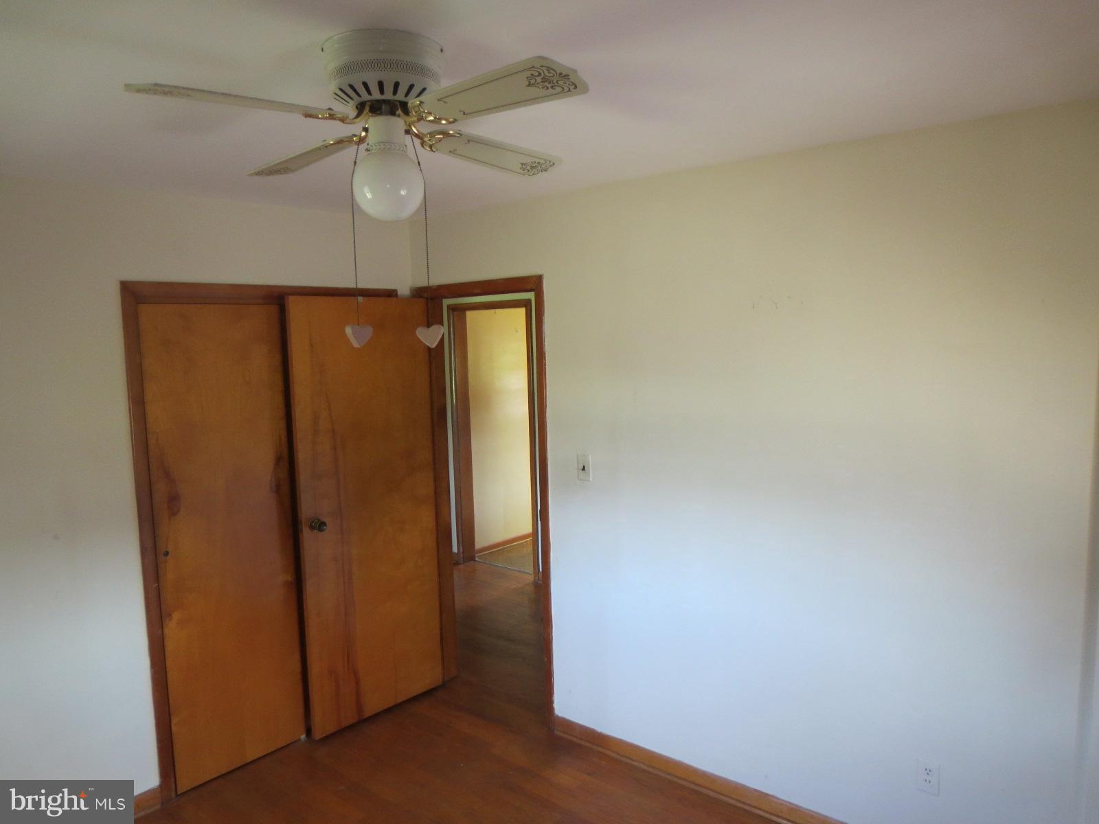 230 West Bay Front Road Lothian, MD 20711 - Photo 25 of 30 a view of a hallway with a chandelier fan