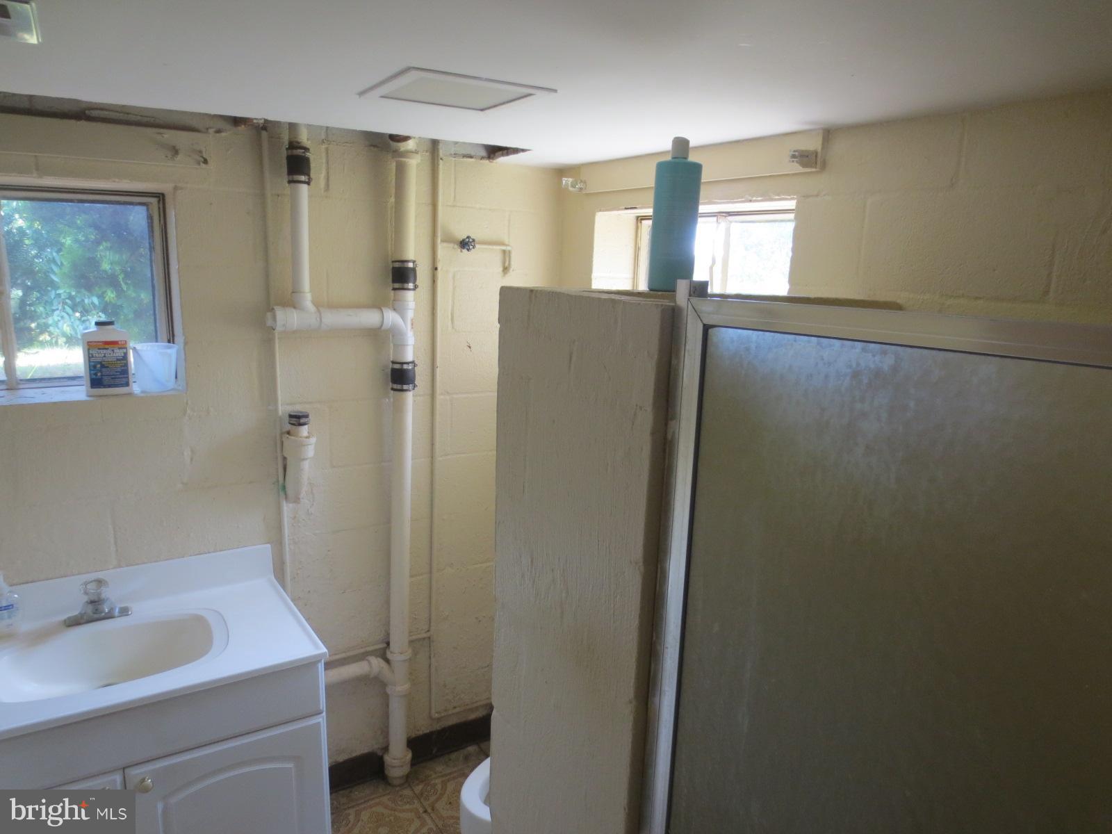 230 West Bay Front Road Lothian, MD 20711 - Photo 29 of 30 a bathroom with a sink a toilet and shower