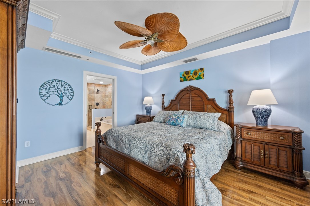 2743 First Street, Unit 1101 Fort Myers, FL 33916 - Photo 20 of 49 a bedroom with a bed and dresser