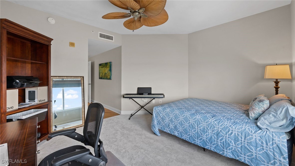2743 First Street, Unit 1101 Fort Myers, FL 33916 - Photo 25 of 49 a bedroom with furniture and a window