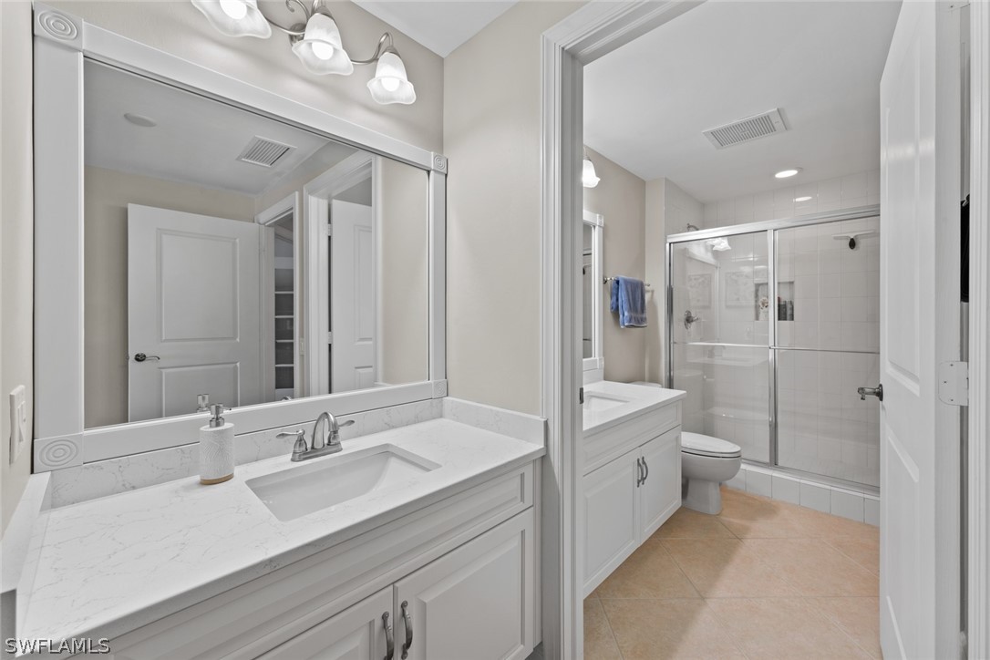 2743 First Street, Unit 1101 Fort Myers, FL 33916 - Photo 27 of 49 a bathroom with a double vanity sink mirror double and shower