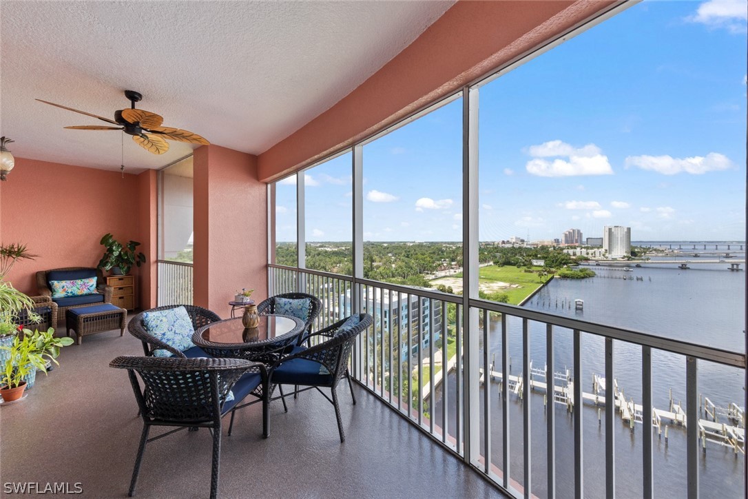 2743 First Street, Unit 1101 Fort Myers, FL 33916 - Photo 37 of 49 a dining room with furniture and a floor to ceiling window