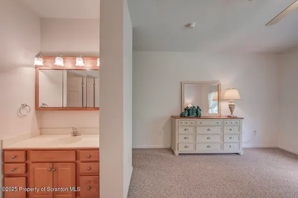 a view of empty room with wooden walls