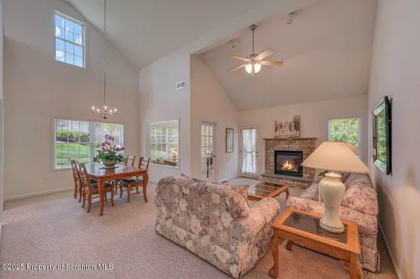 a view of a dining room with furniture window and outside view