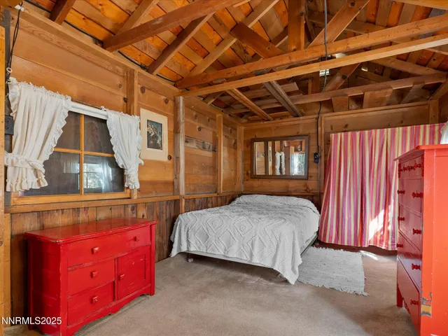 a view of a house with cars park