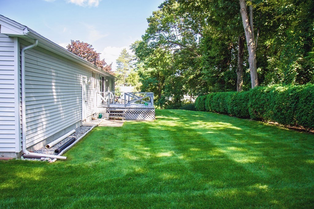 106 Lawrence Road Chicopee, MA 01013 - Photo 12 of 39 a backyard of a house with table and chairs