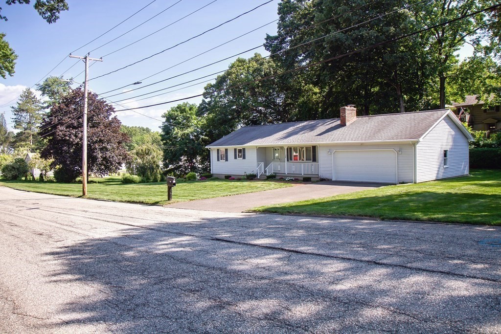 106 Lawrence Road Chicopee, MA 01013 - Photo 2 of 39 a house with garden in front of it