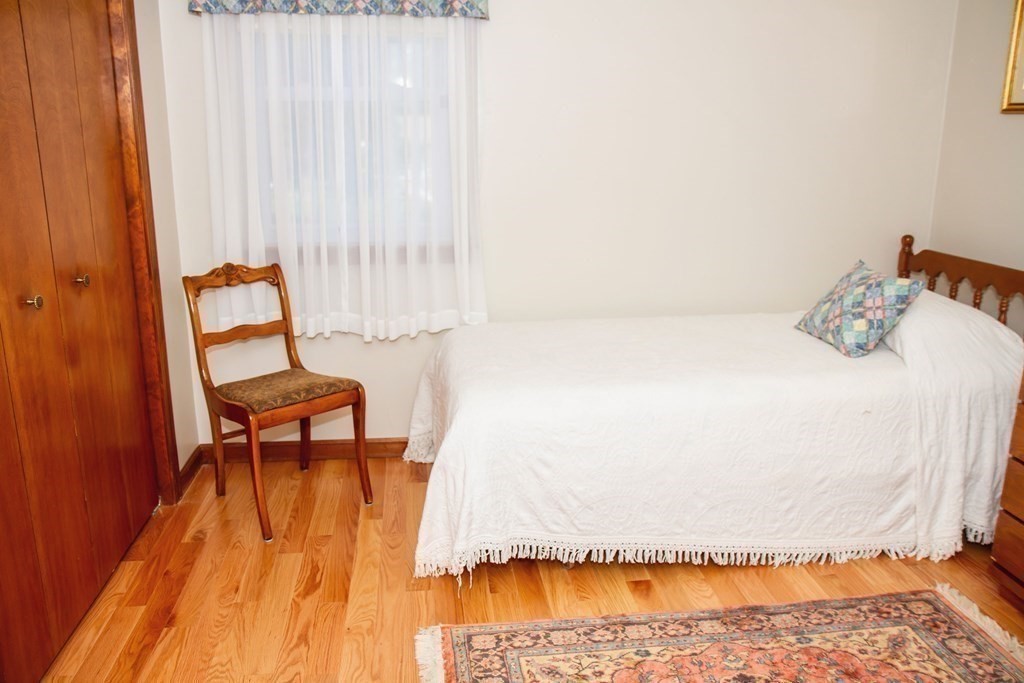 106 Lawrence Road Chicopee, MA 01013 - Photo 28 of 39 a bedroom with a bed and a chair