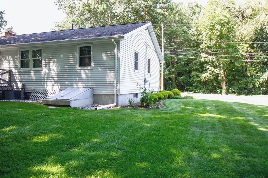 106 Lawrence Road Chicopee, MA 01013 - Photo 7 of 39 a front view of a house with a yard