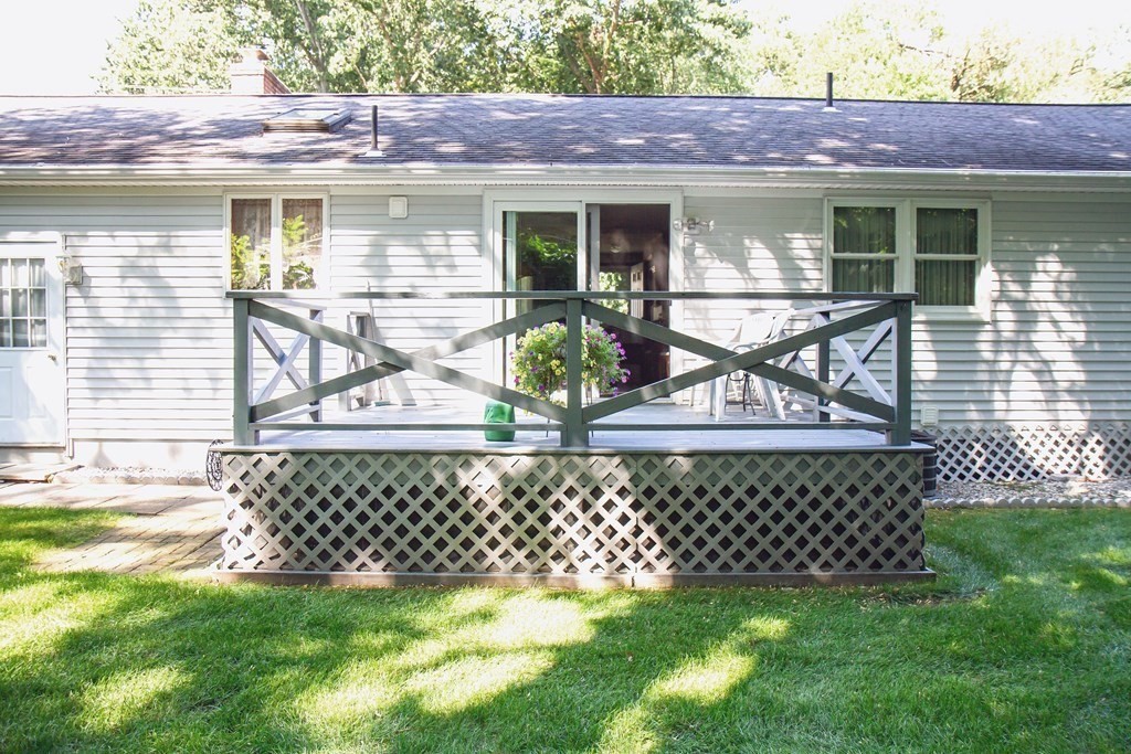 106 Lawrence Road Chicopee, MA 01013 - Photo 9 of 39 a view of a chairs and table in back yard of a house