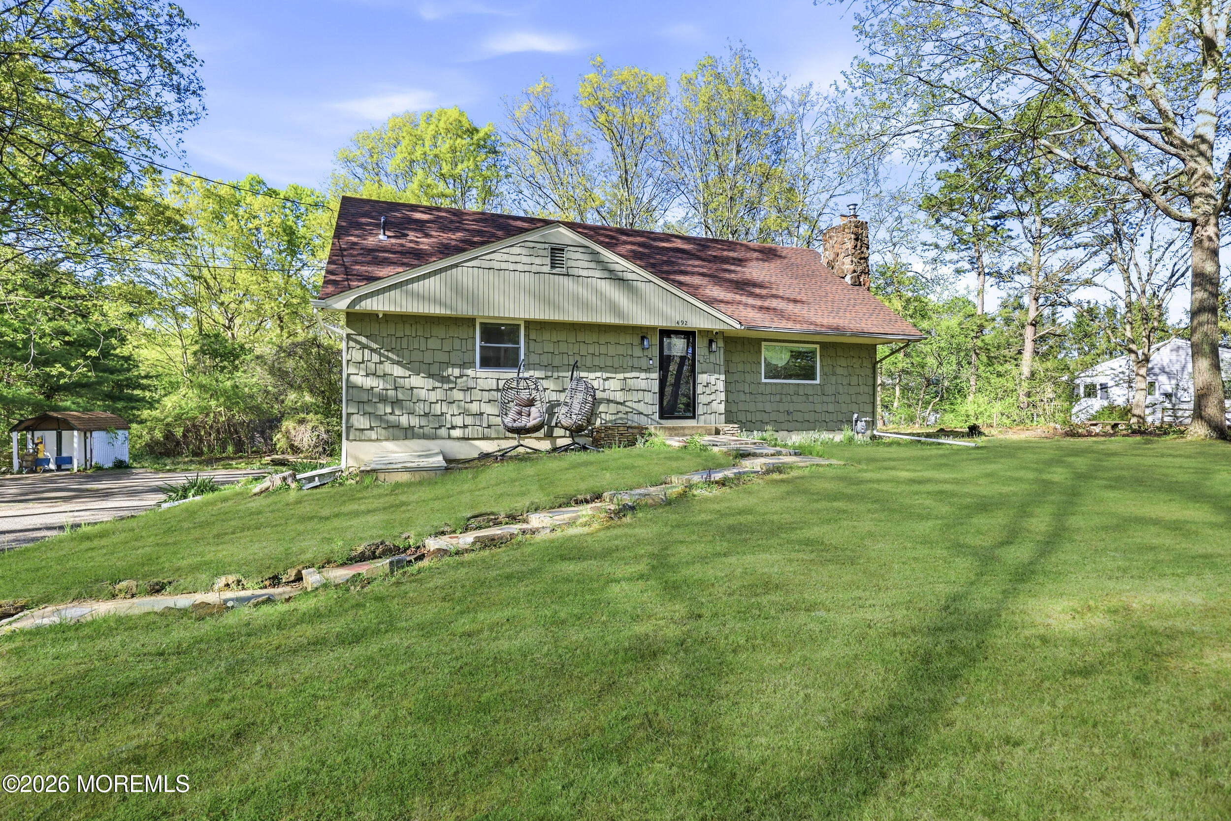 a front view of a house with garden