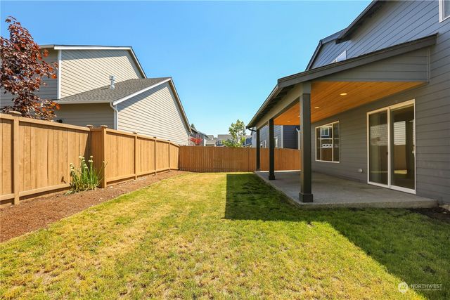 a view of a backyard of the house