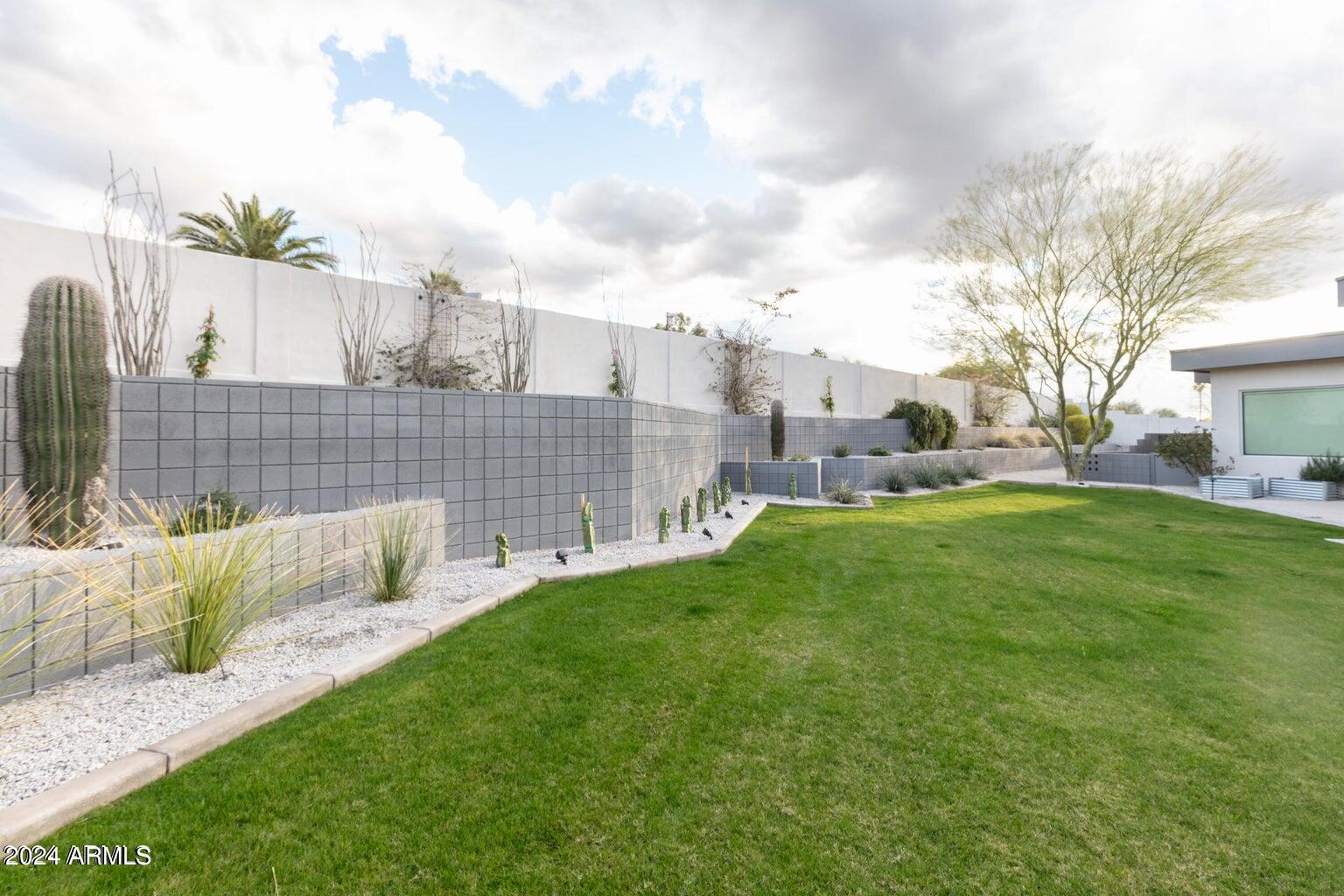 5833 North 46th Street Phoenix, AZ 85018 - Photo 28 of 29 a view of backyard with outdoor seating and green space