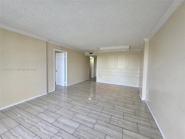 a view of an empty room and window