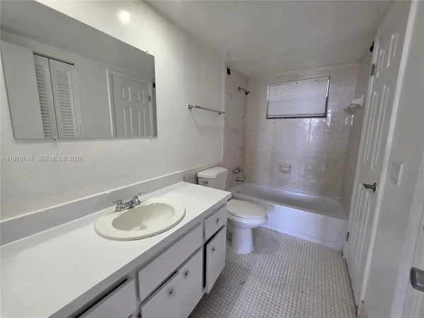 a bathroom with a sink double vanity granite toilet tub and shower