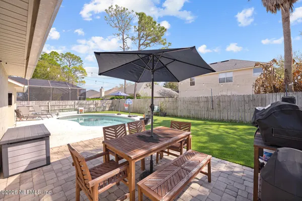a view of an outdoor sitting area with swimming pool