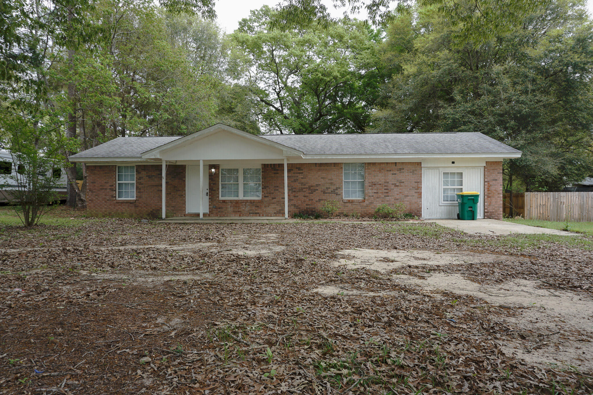 6115 Willow Lane North Crestview, FL 32539 - Photo 1 of 29 a front view of a house with a garden