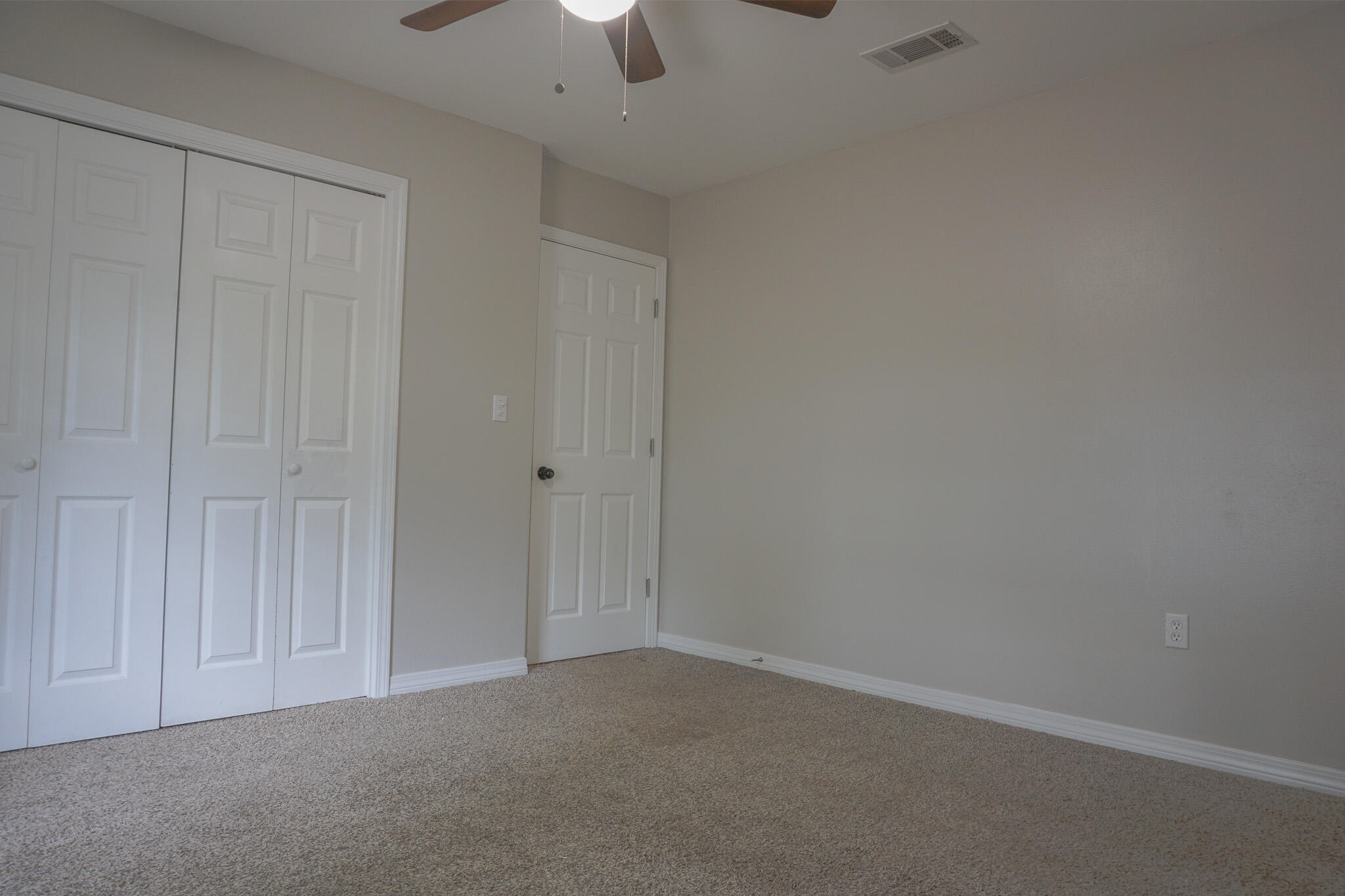 6115 Willow Lane North Crestview, FL 32539 - Photo 12 of 29 an empty room with a chandelier fan