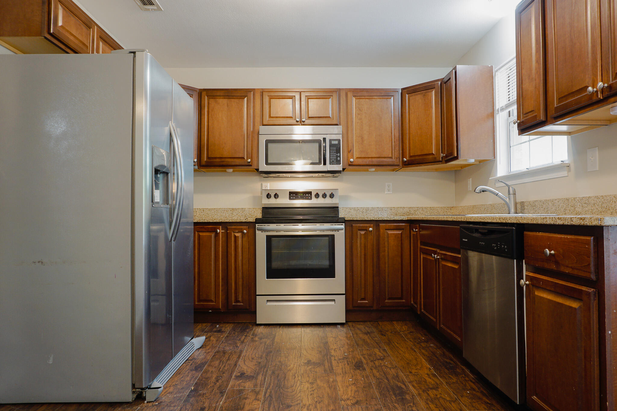 6115 Willow Lane North Crestview, FL 32539 - Photo 16 of 29 a kitchen with granite countertop a stove and a sink