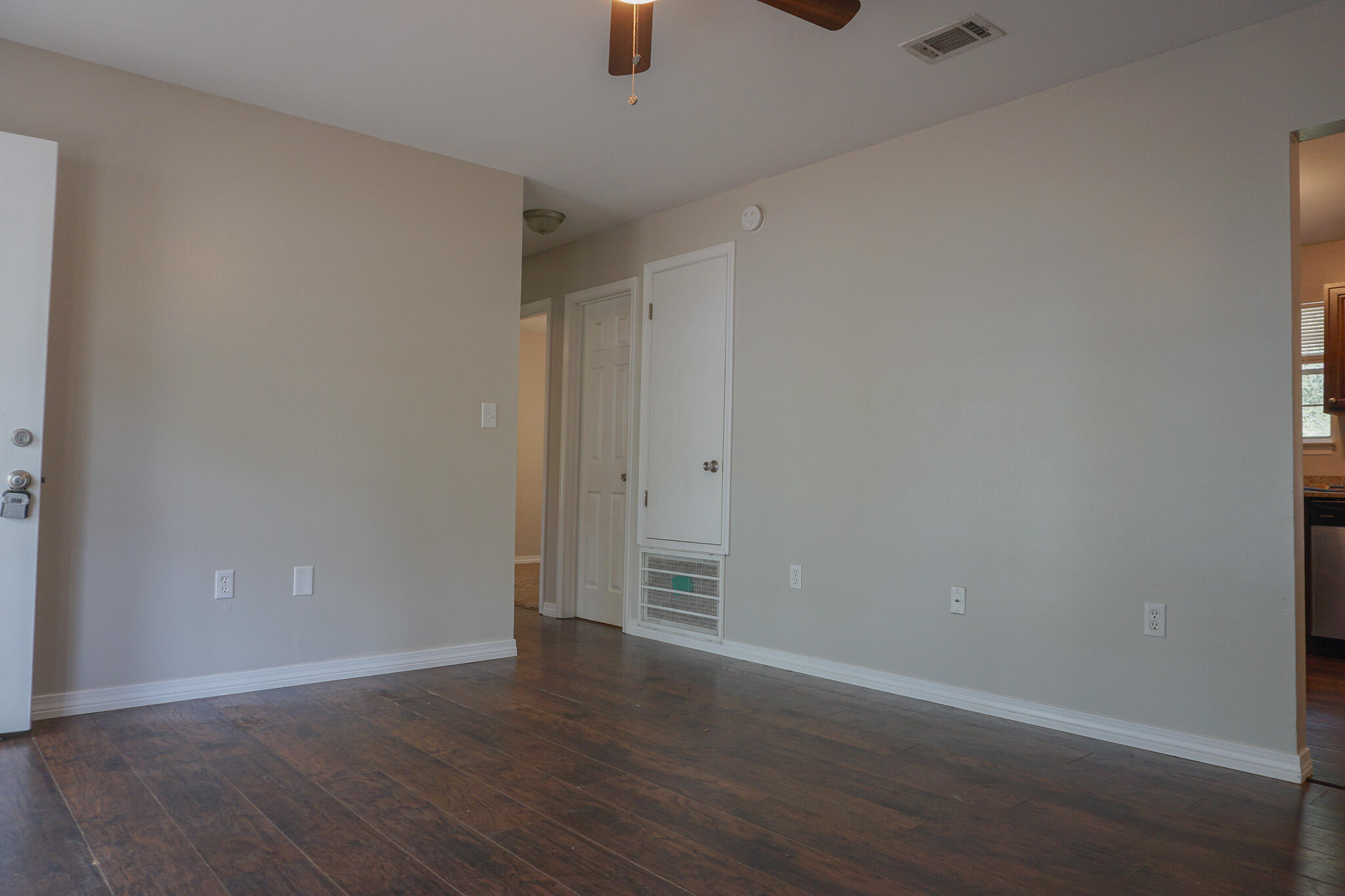 6115 Willow Lane North Crestview, FL 32539 - Photo 6 of 29 a view of an empty room with wooden floor