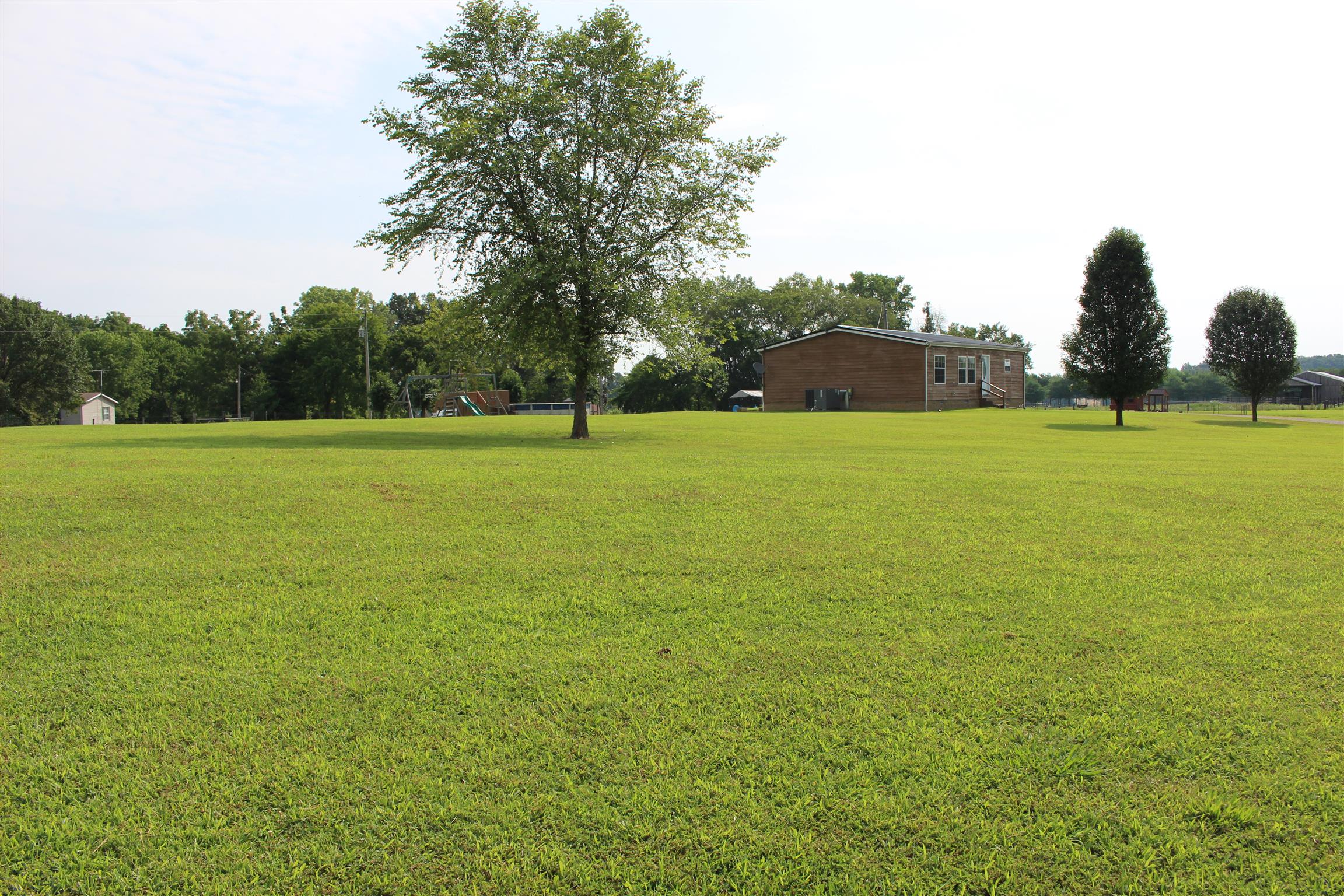 5363 Dowlen Road Cedar Hill, TN 37032 - Photo 2 of 20 Side view of home from road.