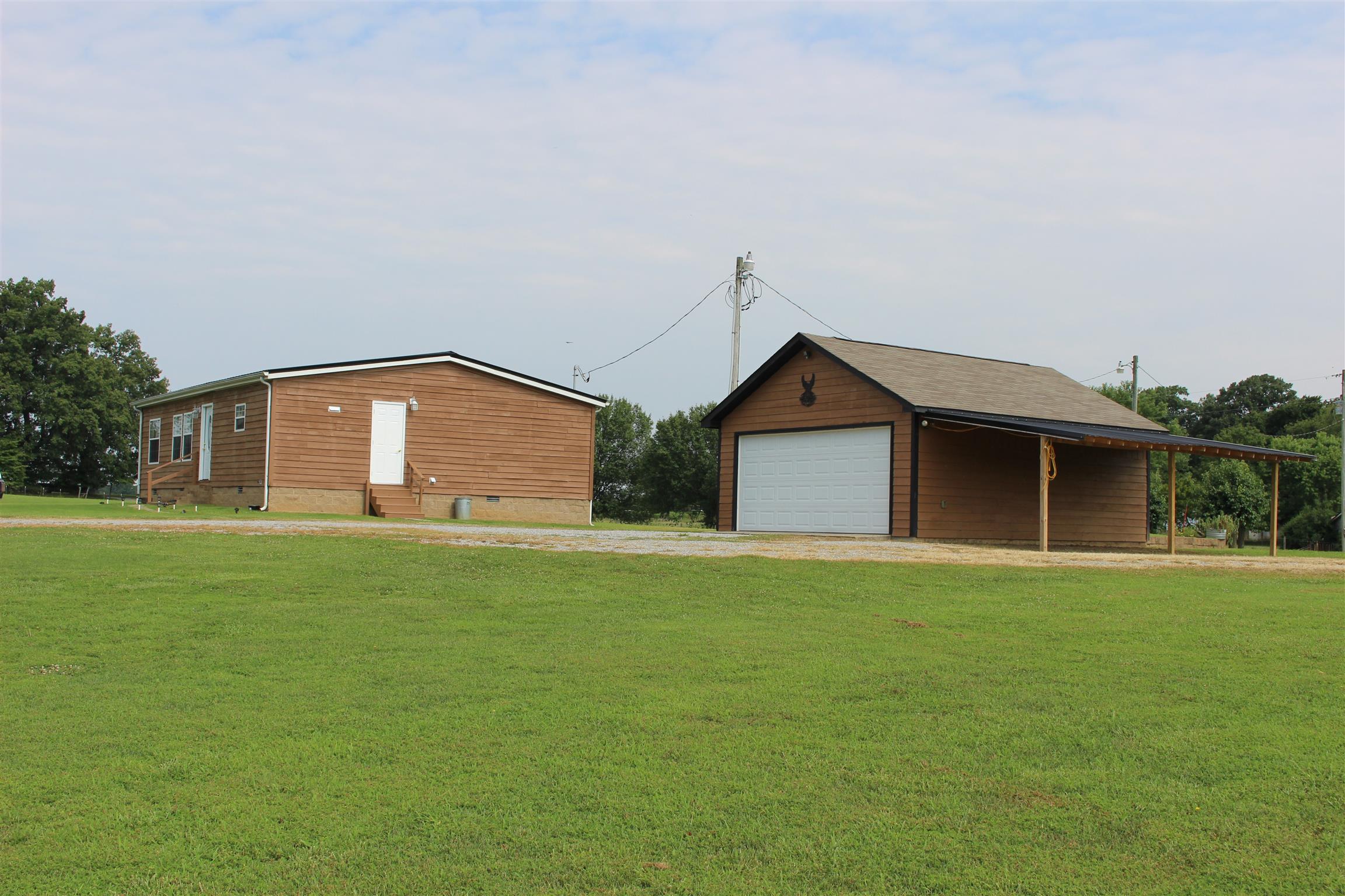 5363 Dowlen Road Cedar Hill, TN 37032 - Photo 3 of 20 Side view of home and detached 2 car garage.