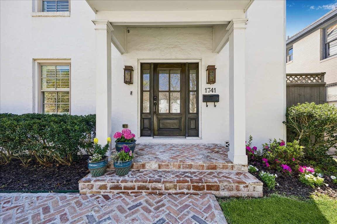 a front view of a house with flowers