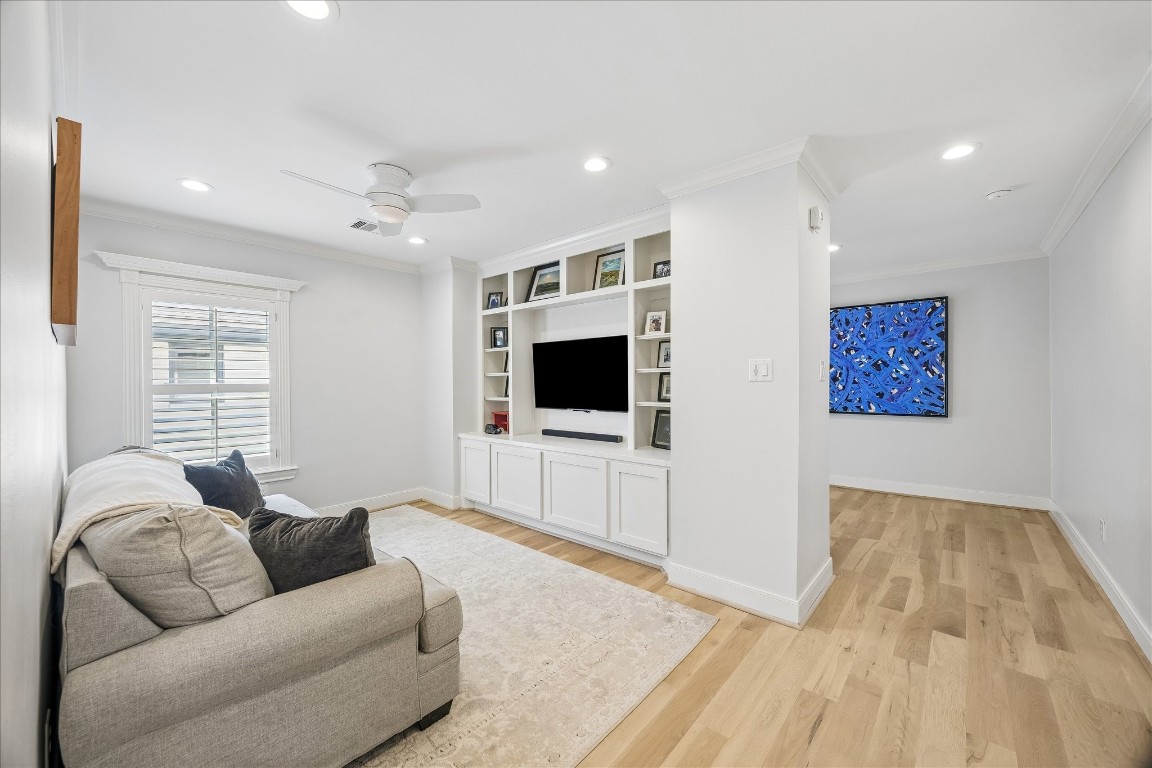 1741 Banks Street Houston, TX 77098 - Photo 12 of 31 a living room with furniture and a flat screen tv