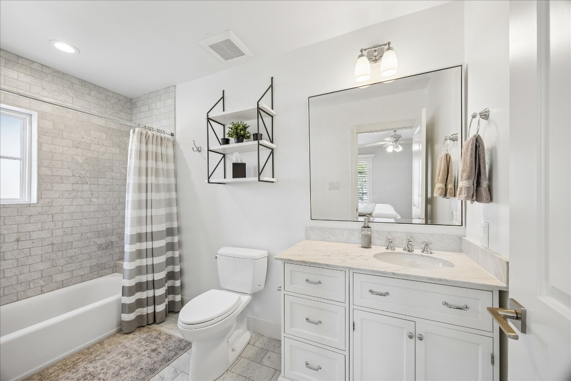 1741 Banks Street Houston, TX 77098 - Photo 16 of 31 a bathroom with a sink toilet and shower