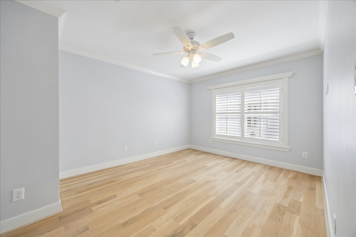 1741 Banks Street Houston, TX 77098 - Photo 17 of 31 a view of an empty room with wooden floor and a window