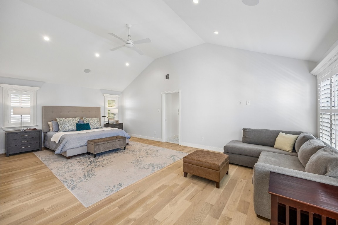 1741 Banks Street Houston, TX 77098 - Photo 19 of 31 a spacious bedroom with a bed a couch and a window