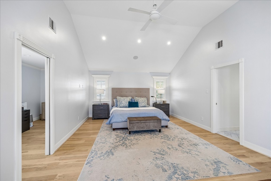 1741 Banks Street Houston, TX 77098 - Photo 20 of 31 a spacious bedroom with a bed and a walk in closet