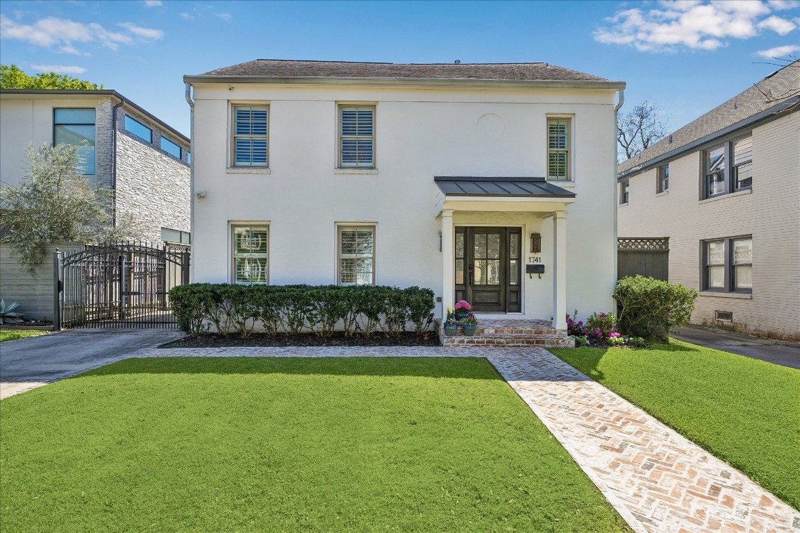 1741 Banks Street Houston, TX 77098 - Photo 2 of 31 a front view of a house with a yard