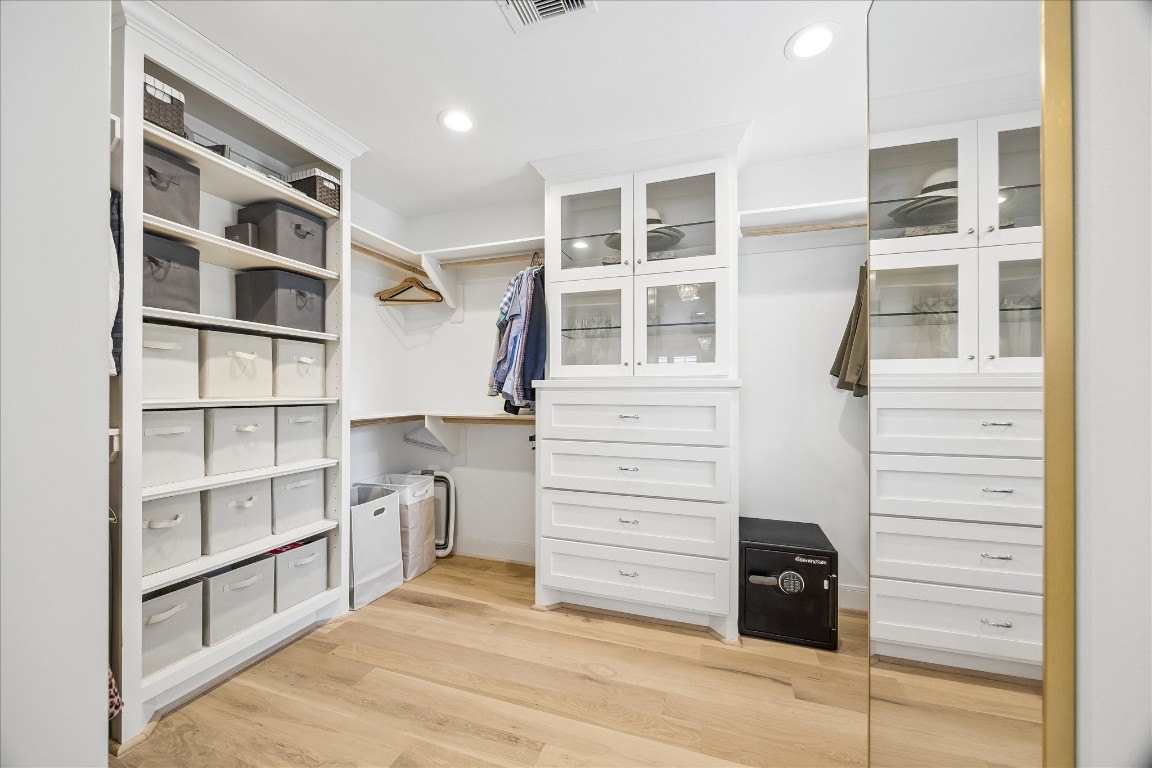 1741 Banks Street Houston, TX 77098 - Photo 23 of 31 a view of walk in closet with empty racks