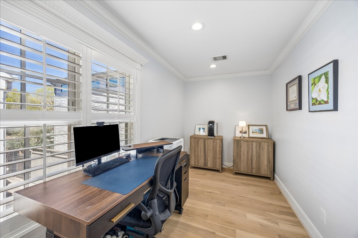 1741 Banks Street Houston, TX 77098 - Photo 24 of 31 a view of a workspace with furniture